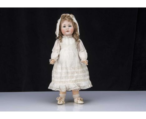 A rare Simon &amp; Halbig 120 character doll, with blue sleeping eyes, delicate light brown painted eyes, open mouth with pro