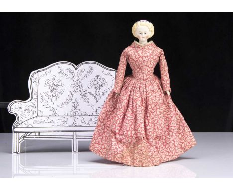 SALROOM ANNOUNCEMENT - this doll as reproduction legs.A rare small German 19th century bisque shoulder head doll with moulded