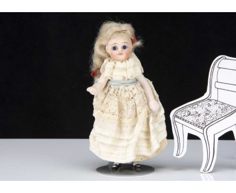 A Simon &amp; Halbig all-bisque dolls’ house doll, with dark glass eyes, closed mouth, long blonde mohair wig, back of head i