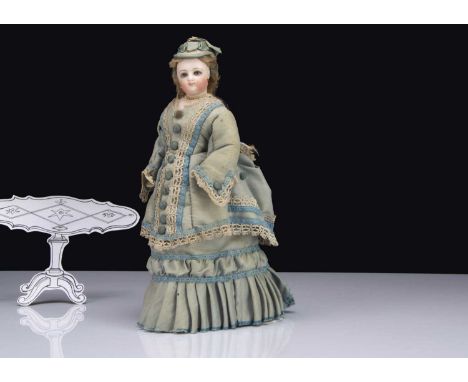 A small Jumeau swivel headed fashionable doll, pressed bisque with grey glass eyes with darker edge to iris, four stroke ligh