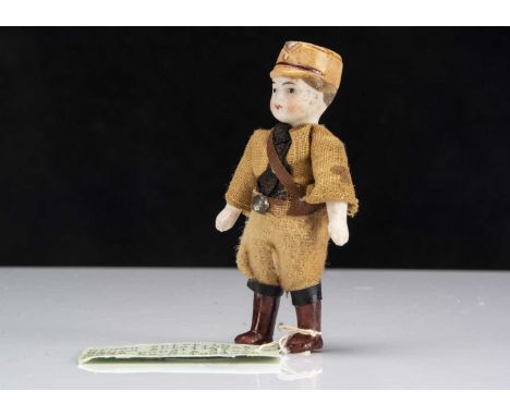 A rare German all-bisque Brown Shirt (SA Sturmabteilung) dolls’ house doll,  with moulded brown cap, pin jointed at shoulders