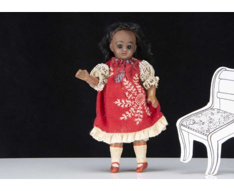 A German bisque headed black dolls’ house doll,  with brown complexion, brown sleeping eyes, black mohair wig, back of head i