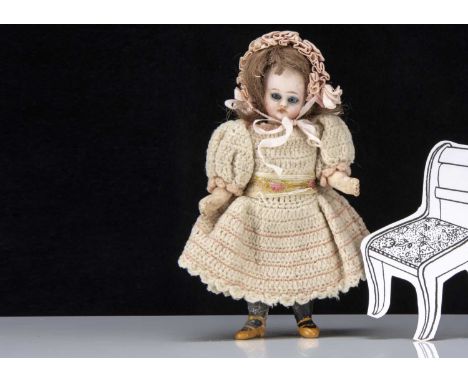 SALEROOM ANNOUNCEMENT - there is some cracking to composition legs.A Simon & Halbig bisque headed dolls’ house doll, with blu