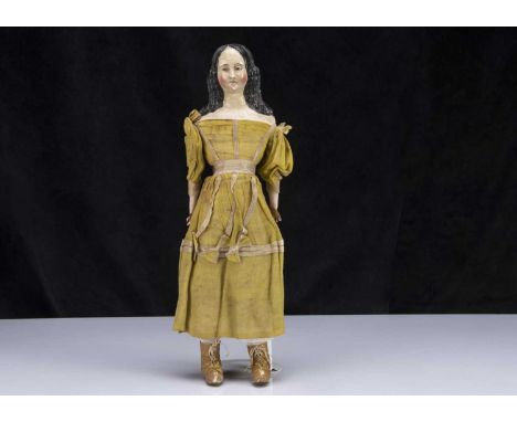 A rare mid 19th century German papier-mache shoulder-head doll with elaborate hair, with head leant slightly to the right, br