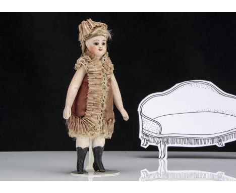 A rare all-bisque French Mignonette dolls’ house doll, with blue glass eyes, closed dark pink mouth and nostril dots, brown b