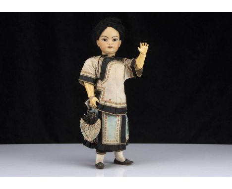 A Simon & Halbig Dep 1129 Asian child,  with brown sleeping slanted eyes, light brown complexion, black painted brows, pierce