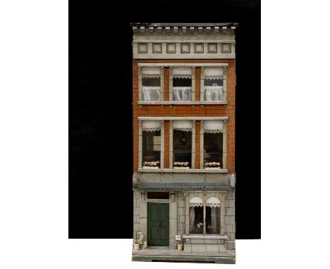 A 19th century Silber &amp; Fleming type box back dolls’ town house, with red brick and grey stone facade, three stories, gre