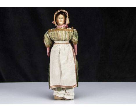 A rare mid 19th century German papier-mache shoulder-head doll with elaborate hair and moulded comb, with two-tone blue paint