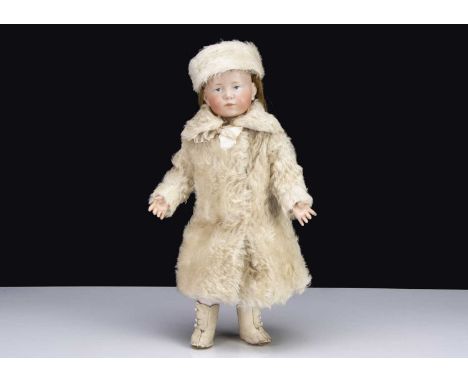 A Kammer & Reinhardt 101 character Marie bisque headed doll,  with blue painted eyes, closed pouty mouth, single stroke light