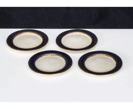Four fine early 20th century dolls' house Continental hard paste porcelain dinner plates,  with cobalt blue rims with very fi