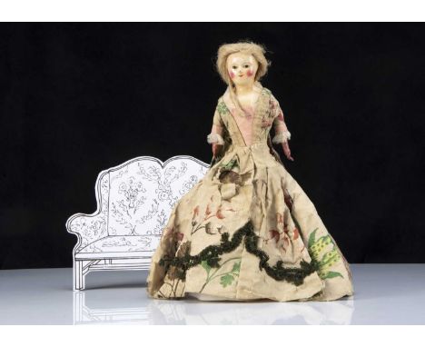 A very rare early English papier-mache shoulder head doll probably by a wooden doll maker circa 1780, with inset dark enamel 