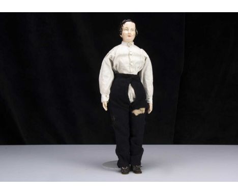 A rare mid 19th century KPM pink tinted china shoulder-head boy doll, with blue painted eyes, a red eyeline to top lid, singl