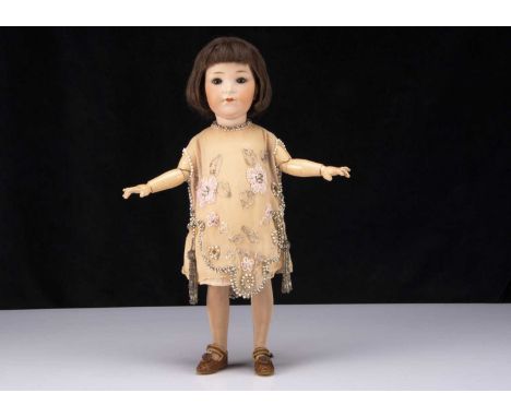 A rare Armand Marseille 400 Flapper doll,  with lashed blue sleeping eyes, brown brows, closed mouth with prominent top lip, 