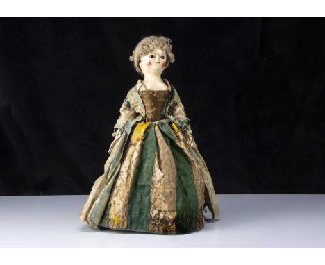 Peggy, a very rare and fine 18th century English wooden doll with family provenance, the carved, turned and painted head and 