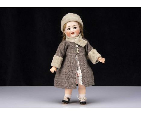 A Kammer & Reinhardt 126 character toddler, with brown lashed sleeping flirting eyes, brown hair wig, jointed composition tod