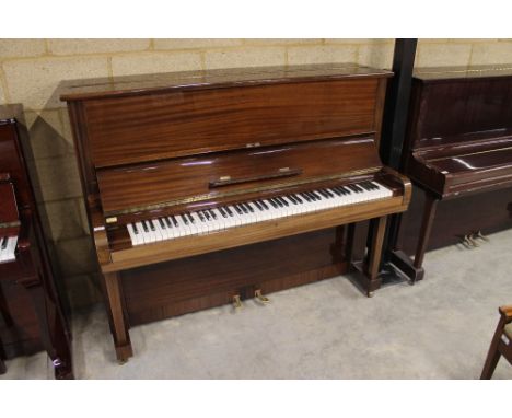 Steinway (c1963) A Model V upright piano in a bright mahogany case; together with a stool.&nbsp;This instrument is sold with 