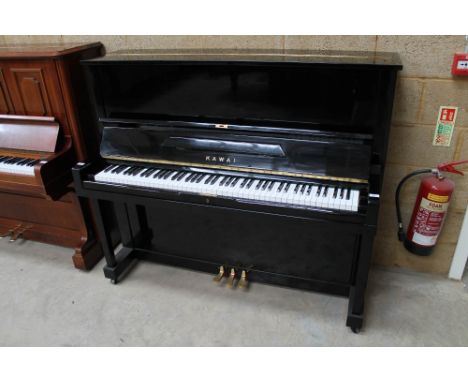 Kawai (c1960) A Model K-8 upright piano in a bright ebonised case. 