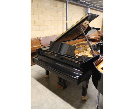 Steinway (c1989) A 9ft Model D grand piano in a bright ebonised case on square tapered legs; together with a padded cover. Th