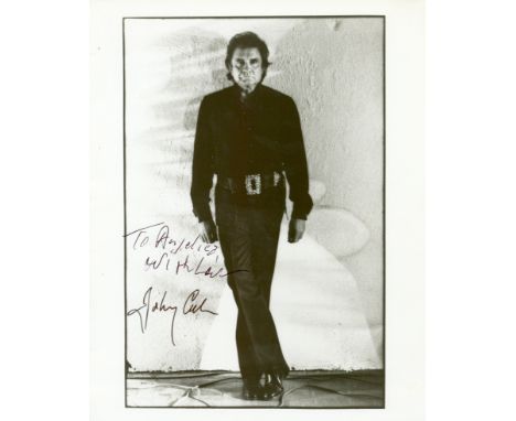 CASH JOHNNY: (1932-2003) American Singer &amp; Songwriter. Signed and inscribed 8 x 10 photograph by Cash, the image depictin