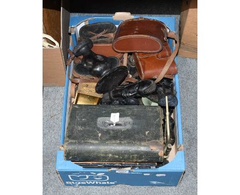 A Group of Various Binoculars in Leather Cases, several North African tribal carvings and a travelling lighting box, etc (one