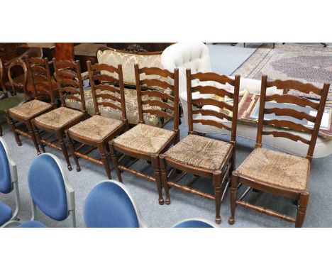 A Set of Six Oak Ladder Back Dining Chairs, with fitted rush seats (6)