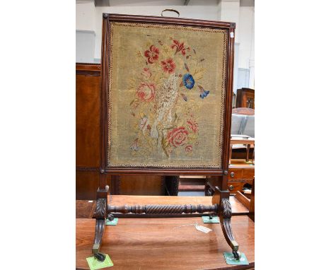 A Victorian Mahogany Firescreen, with needlework panel and lift-up silk panel, 64cm by 110cm