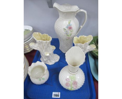A Modern Belleek Porcelain Shaped Ewer, with moulded decoration, printed mark, 26.5cm high; Two Similar Vases, 7cm and 18cm h
