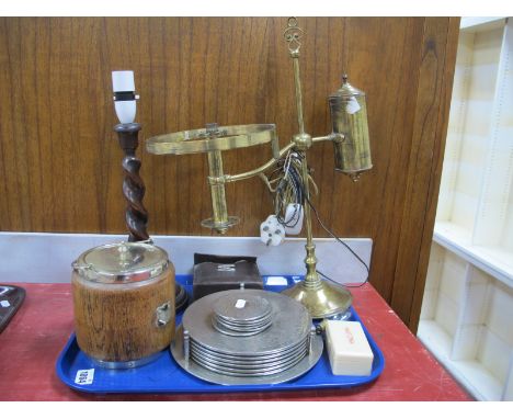 An Oak Biscuit Barrel, table lamp, brass lamp converted to electric, place mats, etc:- One Tray.