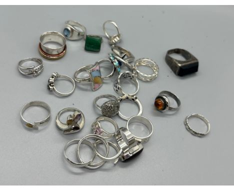 Selection of silver rings includes topaz, enamel, garnet etc 