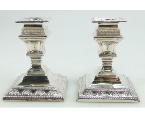 Pair of fine quality silver square base candlesticks, Londion 1890. Loaded bases. Height 11cm base measure 8.5cm x 8.5cm.  Ea
