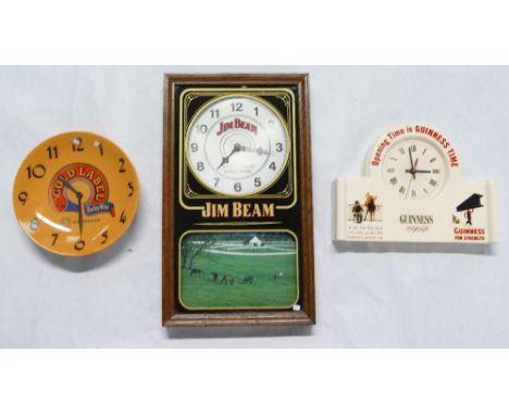A collection of advertising items to include Guinness pottery mantle clock, Whip Red Gold Label wall clock and Jim Beam cased