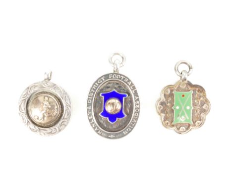 Silver fobs decorated with rose gold and enamel, including Hanley and District Football Association fob. All hallmarked. Tota