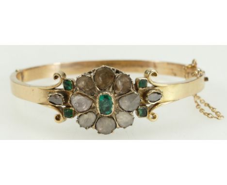 Georgian yellow metal bangle set with 8 large and 2 small rose cut diamonds and 5 emeralds, 24.9 grams