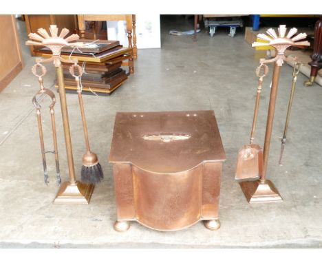 Art Deco brass fireside set to include decorative two handled coal scuttle, two fireside companion sets with full tools. (3)