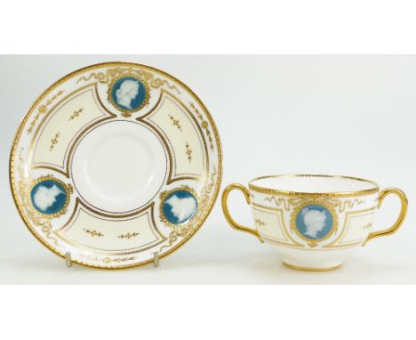 A Minton early 20th century Pâte-sur-Pâte two handled cup & saucer, decorated with various lady portrait panels and raised gi