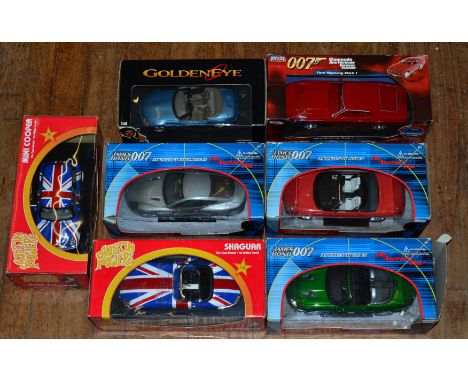 Five James Bond related diecast model cars in 1:18 scale by UT Models and others together with two boxed Joyride 'Austin Powe