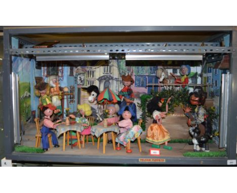 A Pelham Puppet Animated Display Unit, containing: Cat; Pirate (SM); Gypsy; Cowboy; Cowgirl; Gepetto (SL) as waiter; Foal; Ho