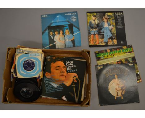 Collection of LP vinyl and 7" singles including- Abba, Johnny Cash singles including The Rolling Stones 'Satisfaction' unboxe