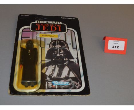 Kenner Star Wars Return of the Jedi Darth Vader 3 3/4" action figure sealed on a 77 back card. Figure is E in G+ but yellow b