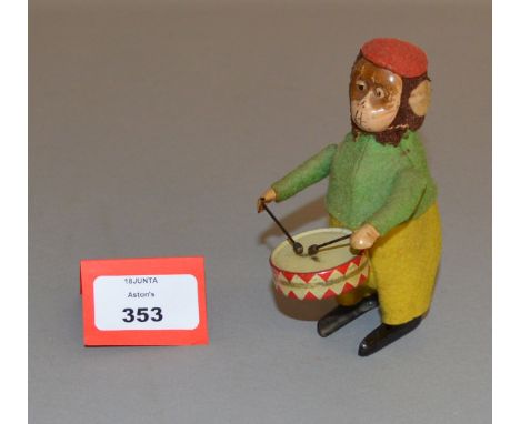 Schuco (Germany) Monkey Drummer, tinplate clockwork monkey (lacking key), dressed in red felt hat, green top and yellow trous