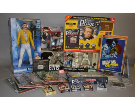 A boxed McFarlane Toys 'Elvis Through the Years' three figure set, a packaged Elvis '68 Comeback' figure and an 'Elvis on Tou