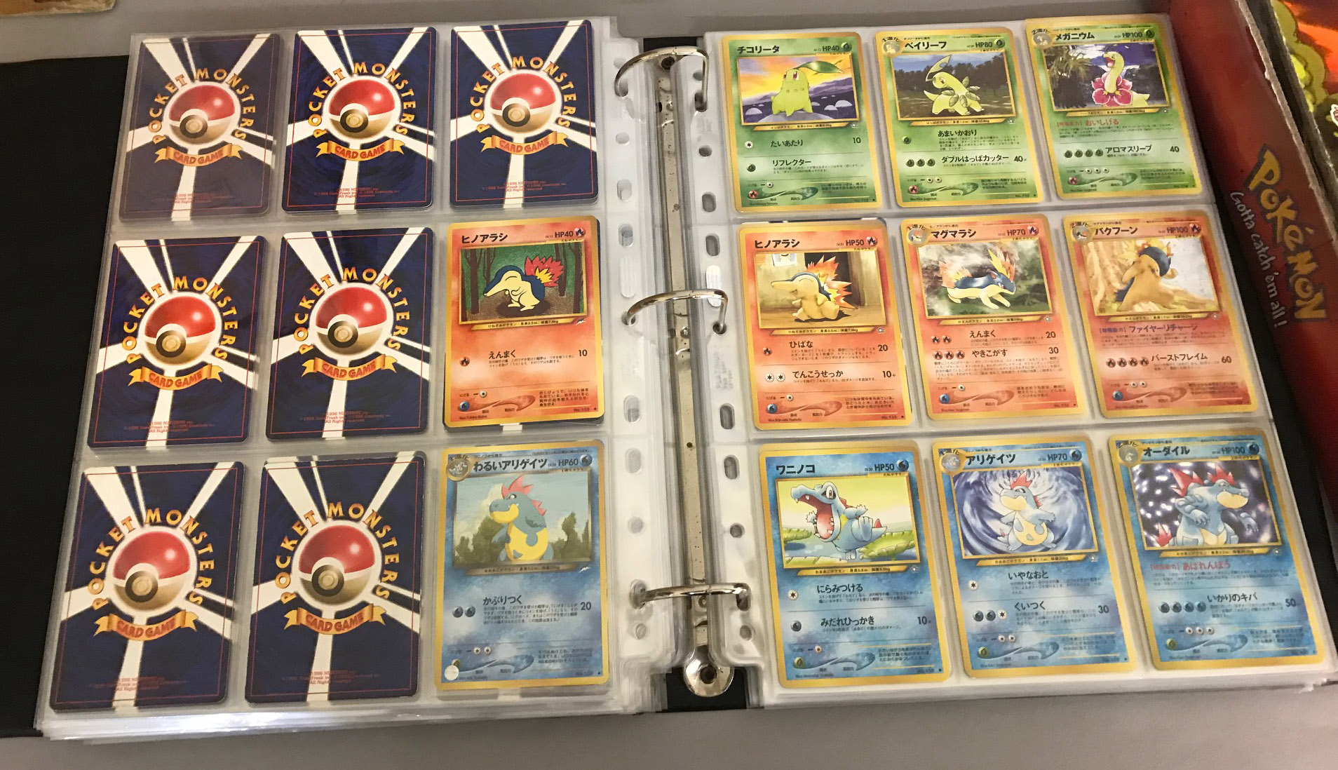Two Pokemon Trading Card folders, full of Pokemon cards. The first