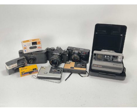 A Mixed Selection of Cameras, A Mixed Selection of Cameras,Including a Polaroid Image System, A Purma Special, a Canon AF35M,