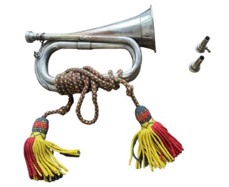 Royal Marines Bugle made by Boosey and Hawkes London showing signs of ageing with a few small dents, with two spare mouthpiec