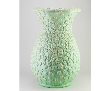 KATE MALONE (born 1959); a monumental stoneware vase with applied flowers covered in glowing lime green glaze with streaky bl