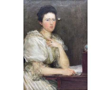 Theodore Blake Wirgman (British 1848-1925): Portrait of a Lady in her Study, oil on canvas signed 35cm x 24cm 