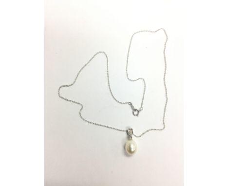 A 9ct white gold cultured pearl and diamond necklace with a Price of Wales chain. Diamonds approx 0.04ct and approx 2.2g.