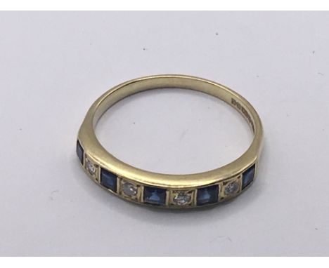 An 18carat gold ring set with alternating sapphire and ruby.