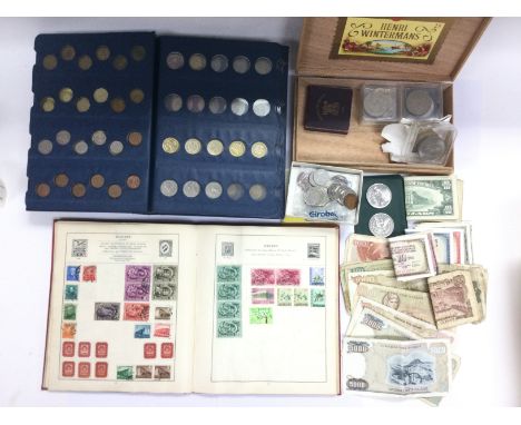 A collection of coins, bank notes, stamps and first day covers.