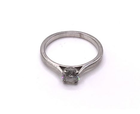 A platinum and approx 0.65ct solitaire diamond ring, Size P, (A).